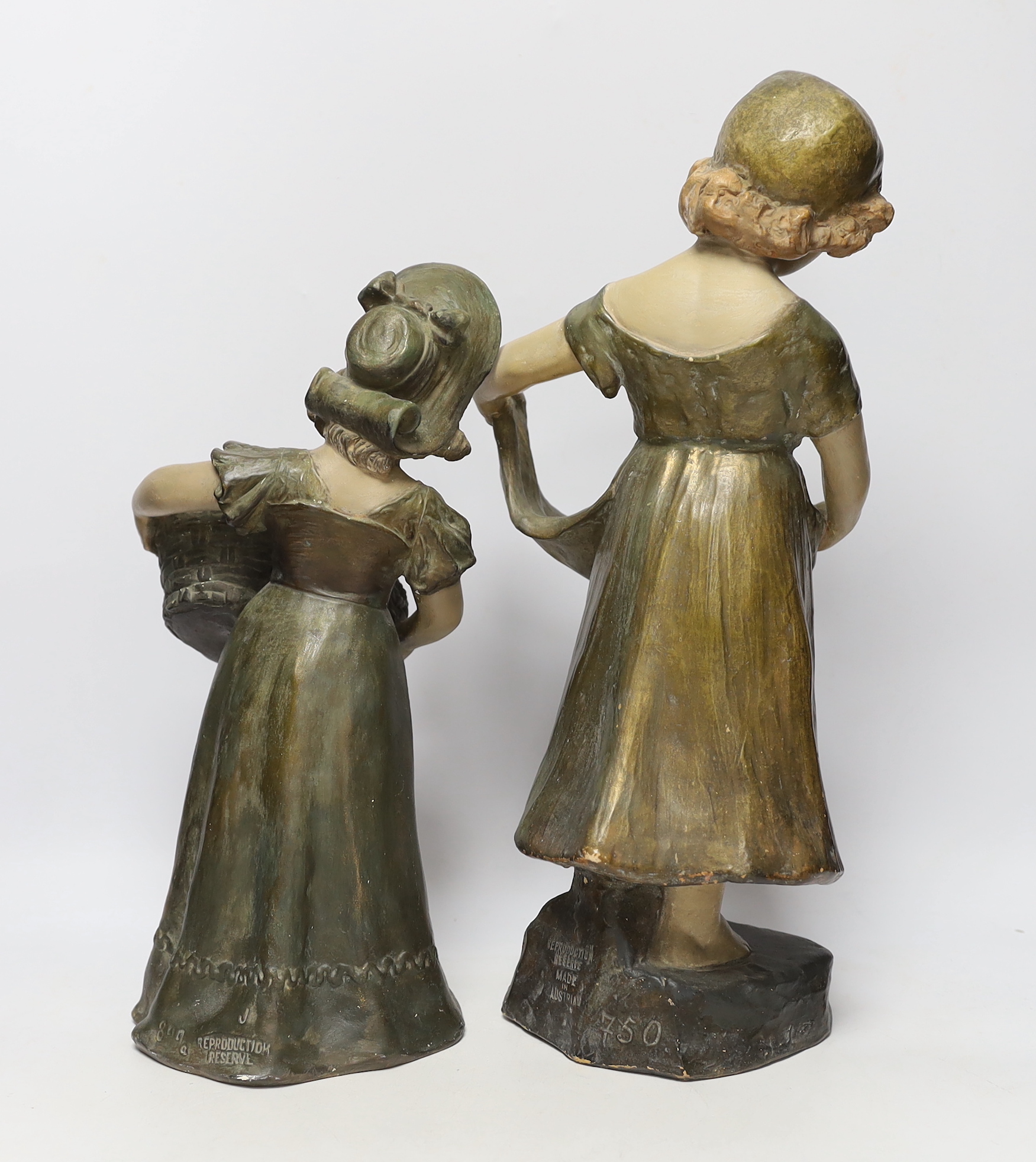 A pair of Austrian cold painted terracotta figurines, largest 45cm high
